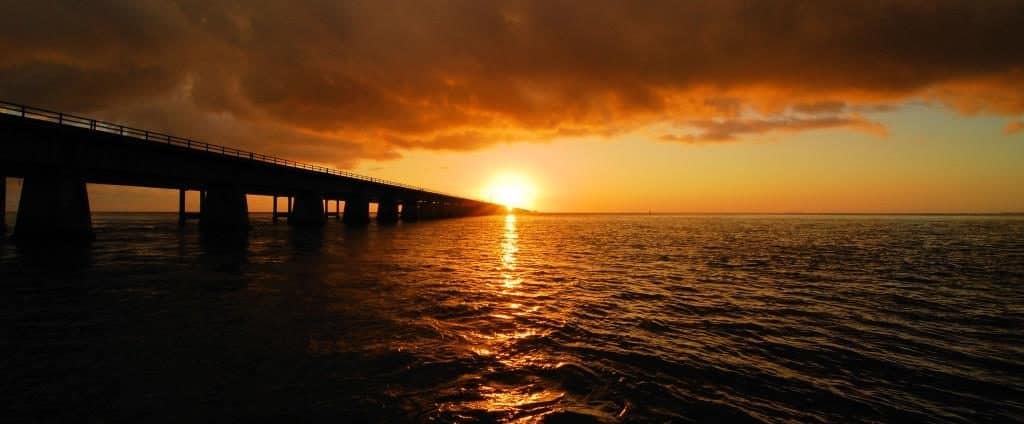 sunset over water with bridge | Taxwise Australia | (08) 9248 8124